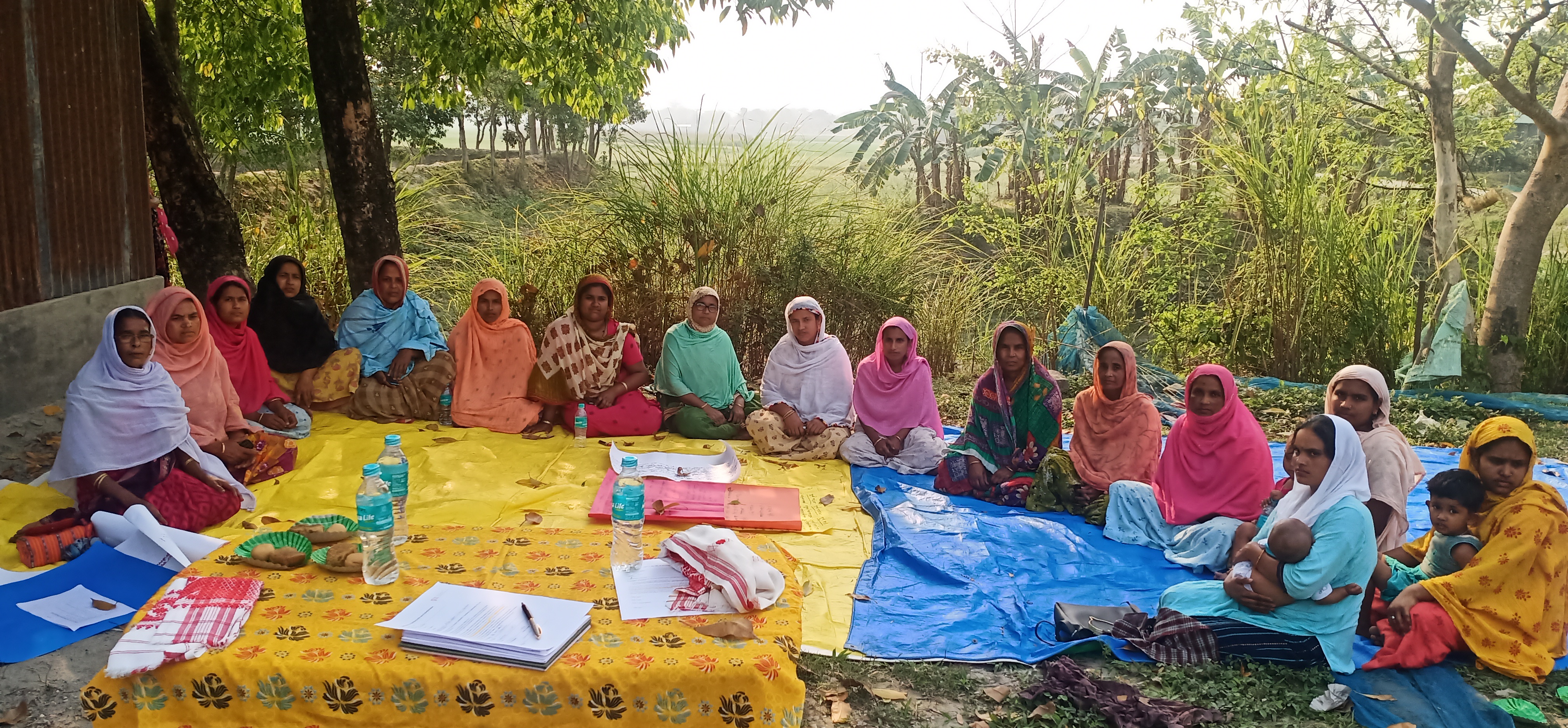 Women sitting together supporting each other in learning on aquaculutre practices