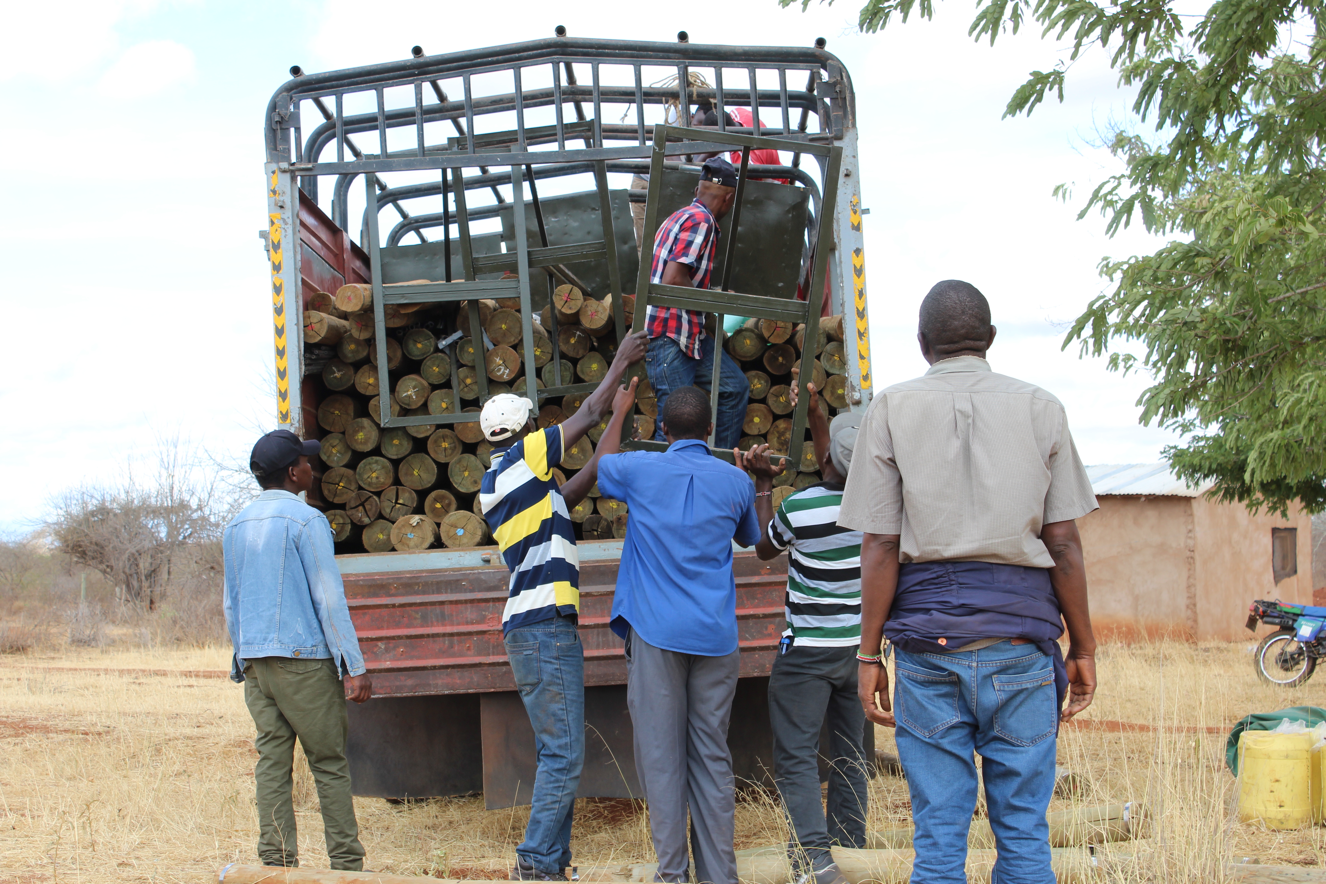 10% Fence plan Materials being ofloaded from a truck