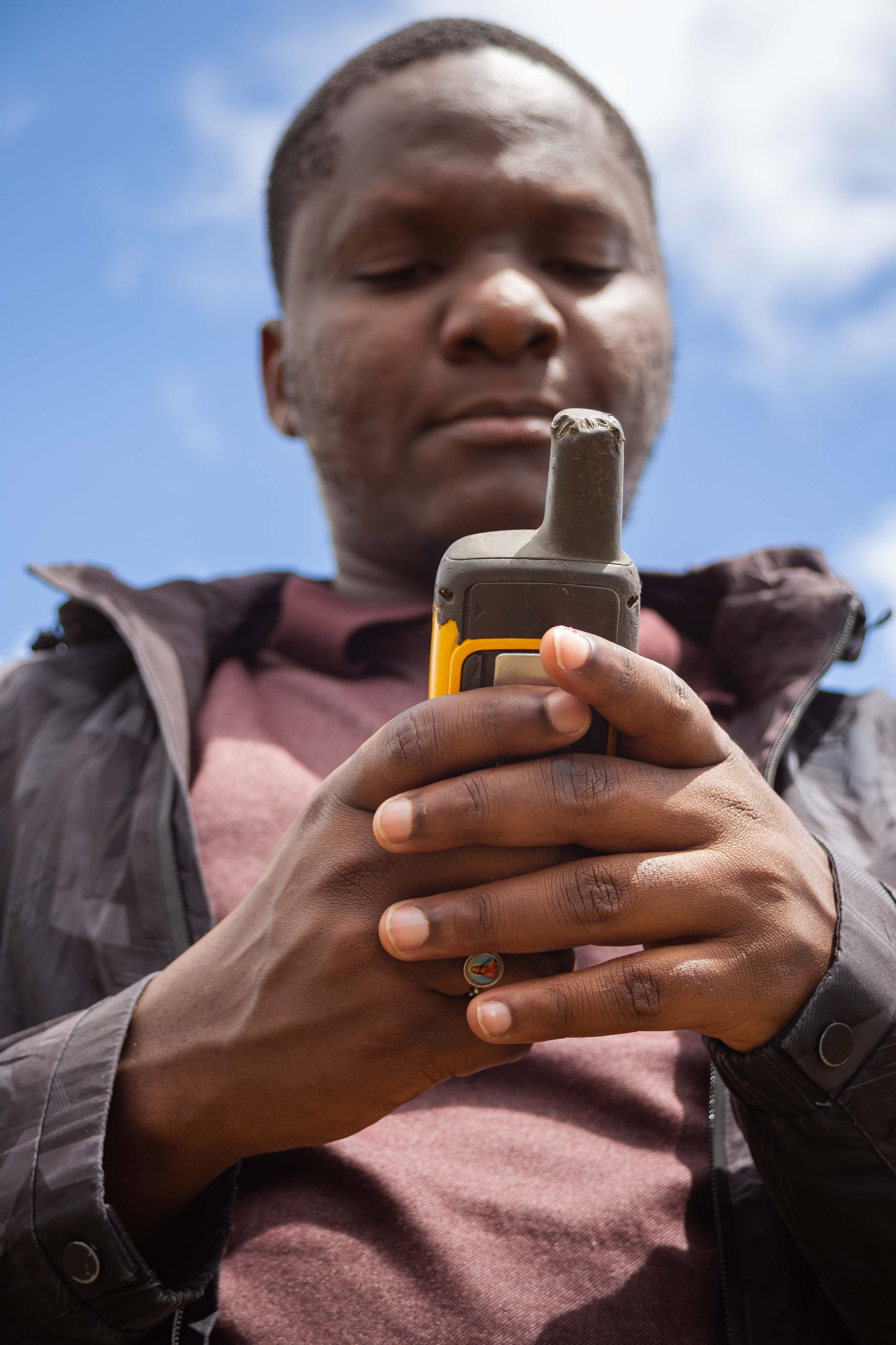 Man stands with a GPS unit