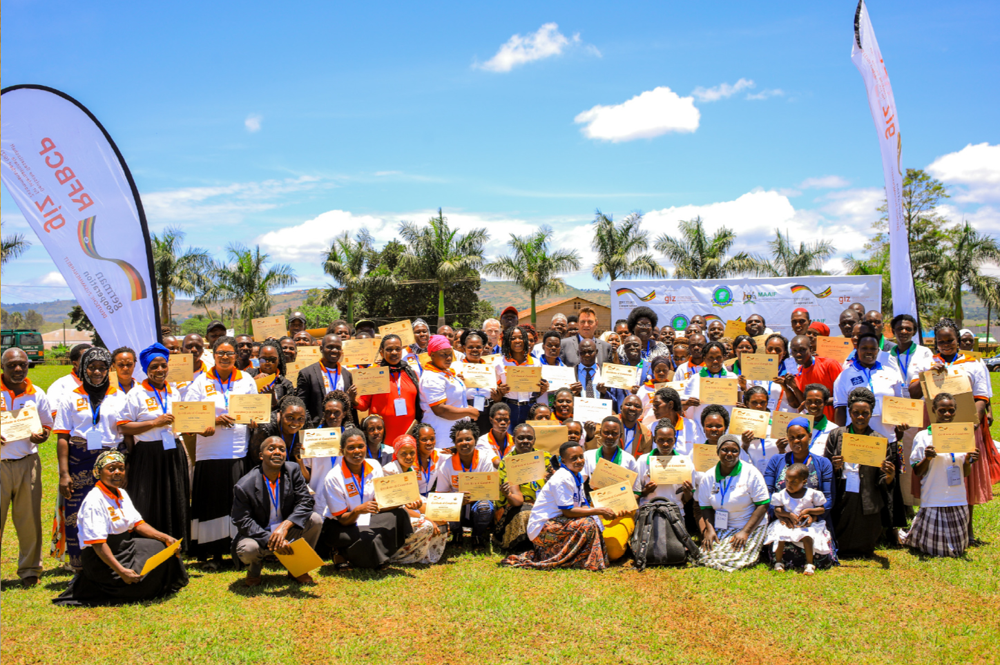 Group picture. Participants holding their certificates up and smiling in the camera.