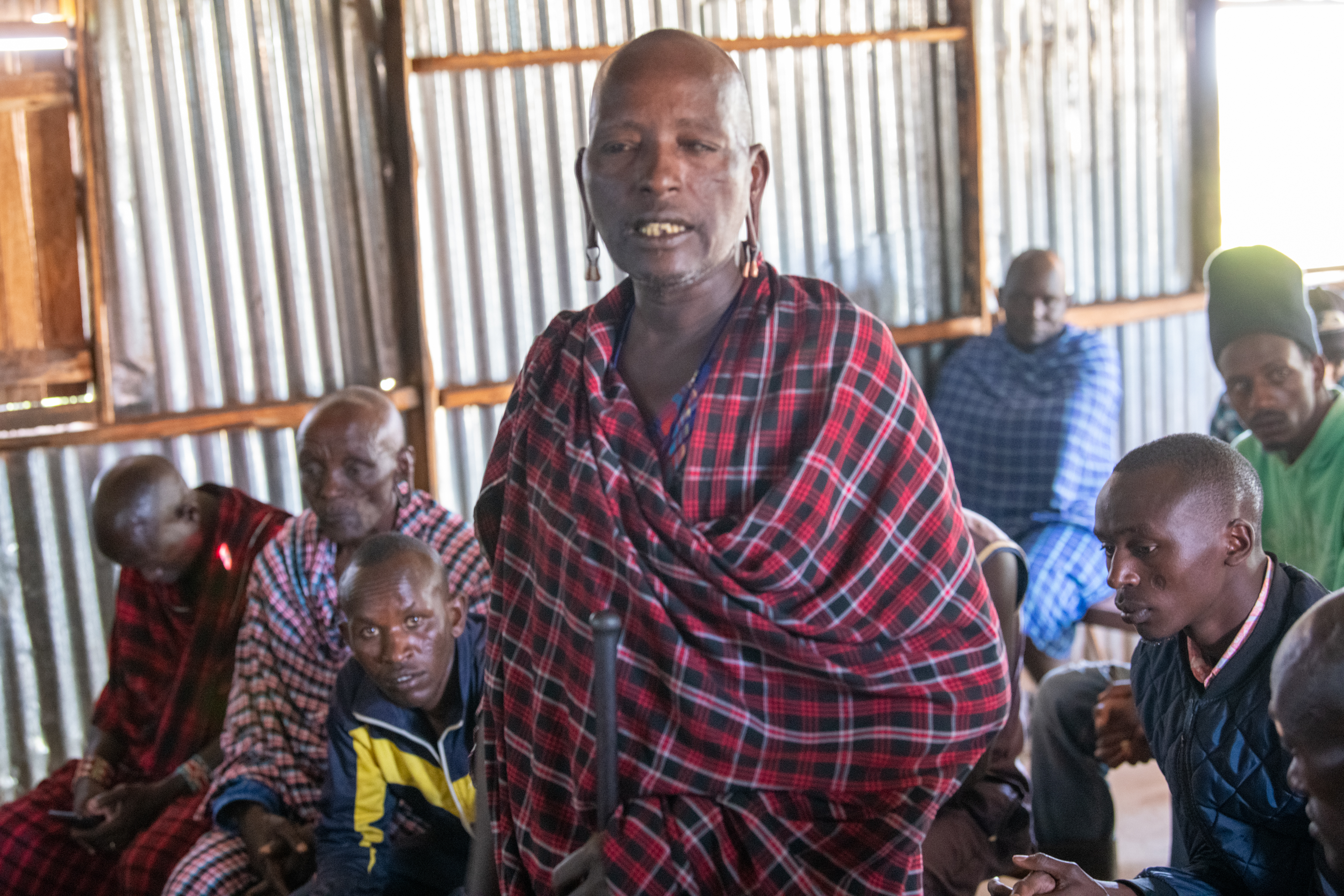 A village elder responds to questions from the trainer during the training that happened in ALOCA 