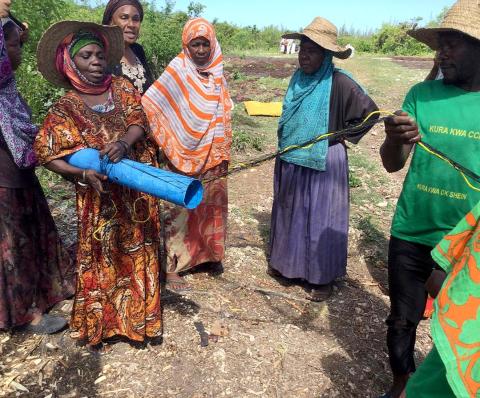 Women explaining the tubular net method for seaweed farming in Zanzibar