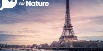 'Sports for Nature' initiative featuring the Eiffel Tower at sunset, with logos of institutional partners