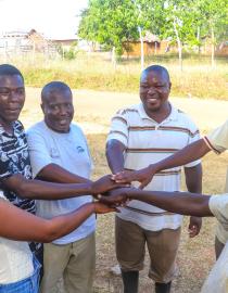 The newly restructured leadership of the Mtakimau Community Forest Association (CFA) stands together in unity following a successful planning meeting.