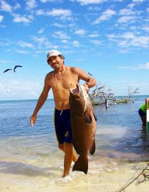 A fisher of Quintana Roo lands his catch Eric Mercier